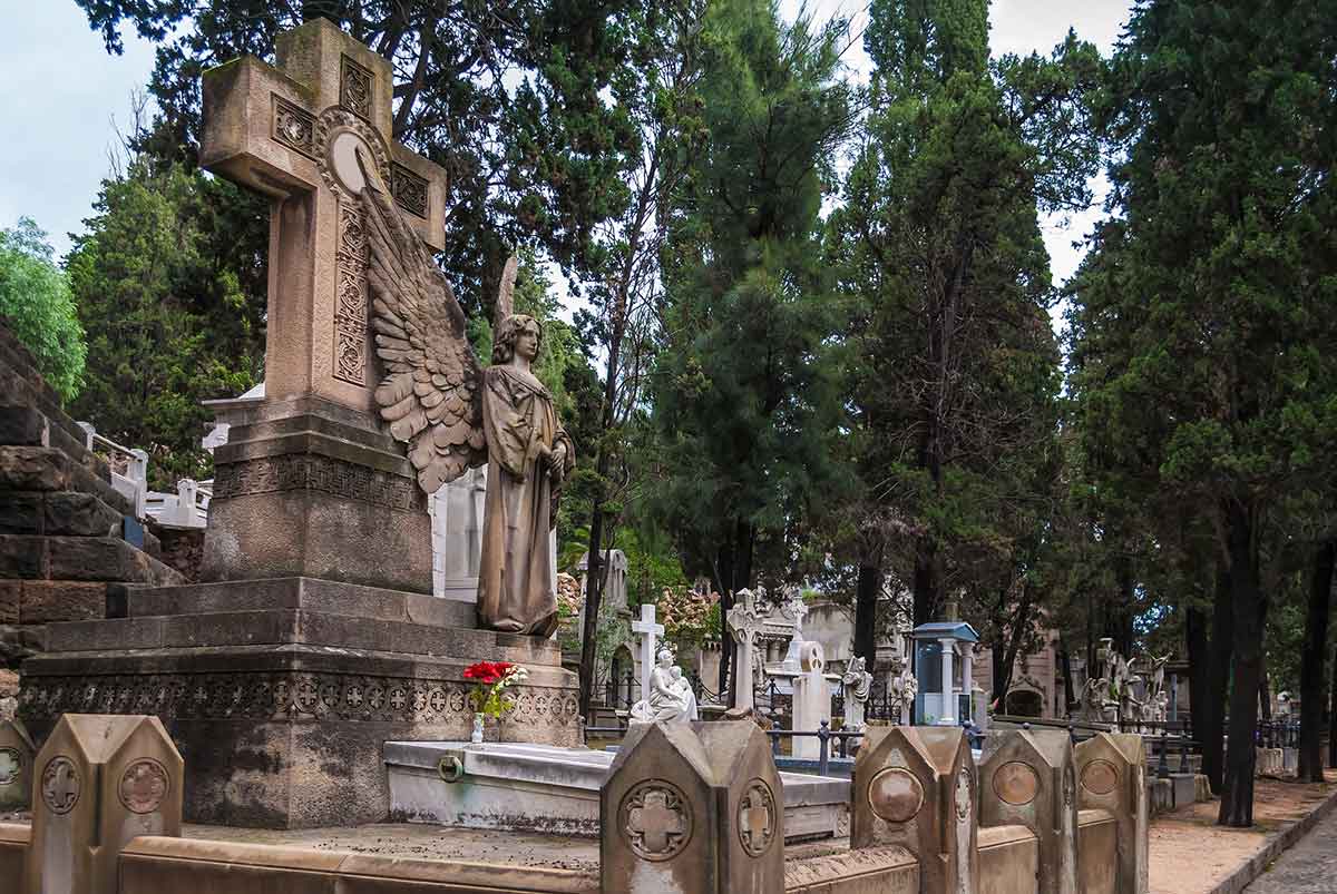 Grave with sculpture of angel on Montjuic Cemetery, Barcelona.