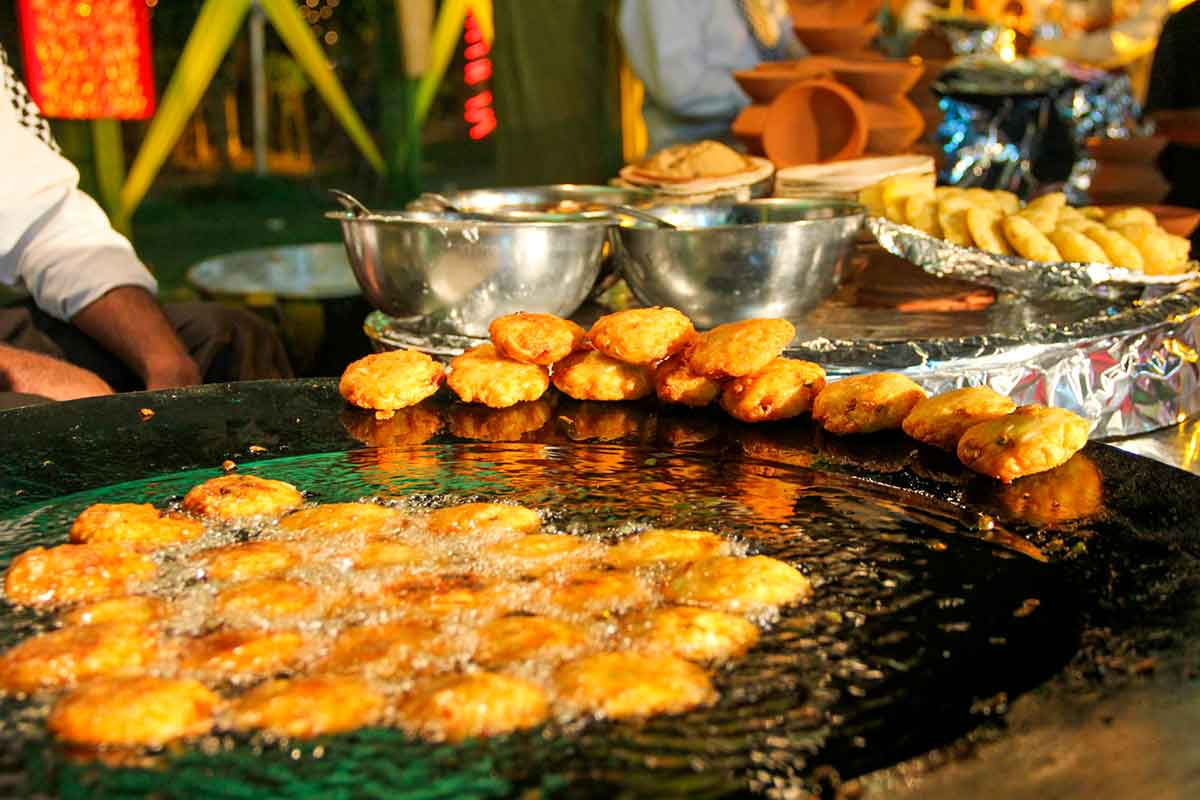 A man selling street food in Delhi, India.