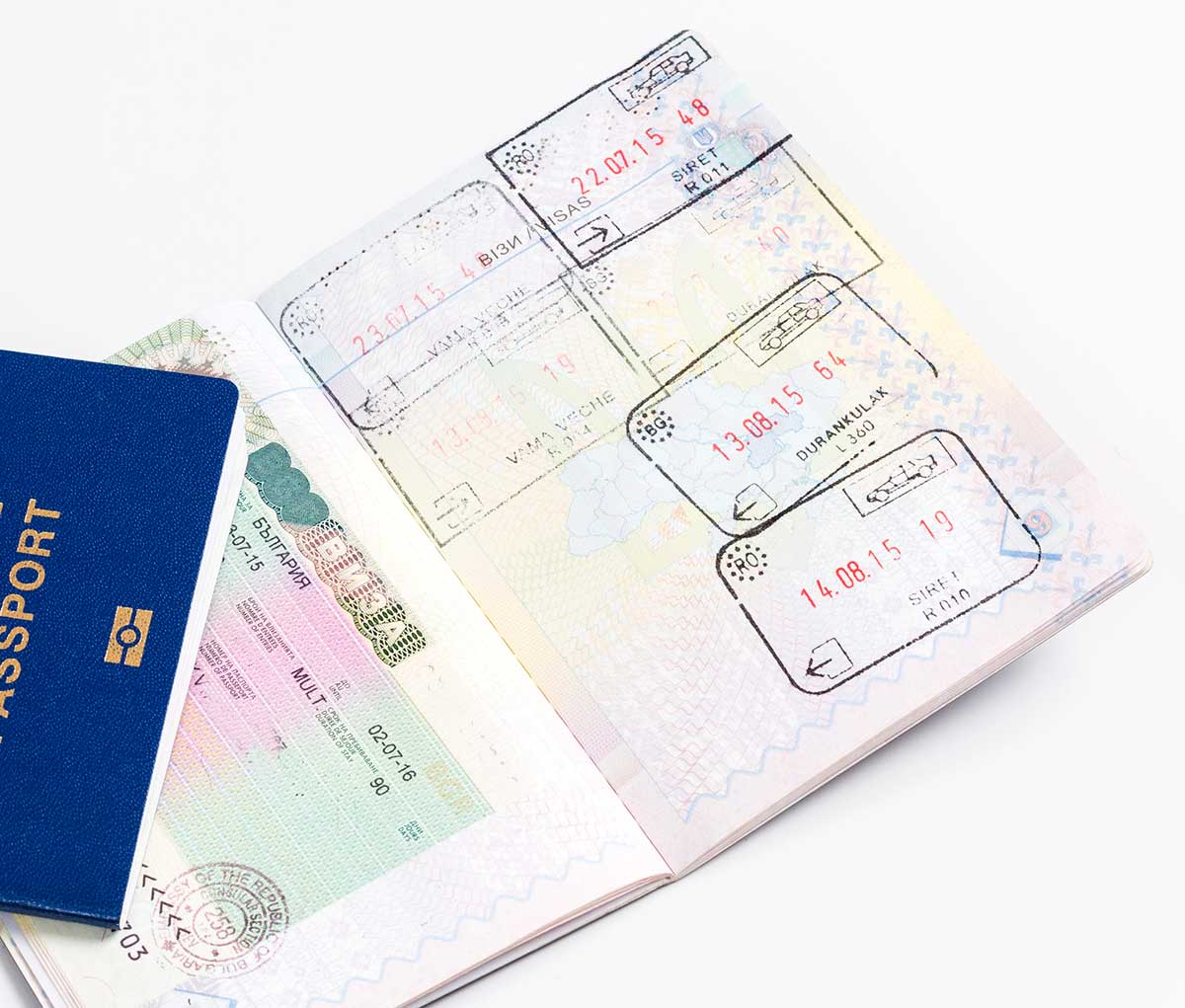 A passport with pages with visas and stamps.