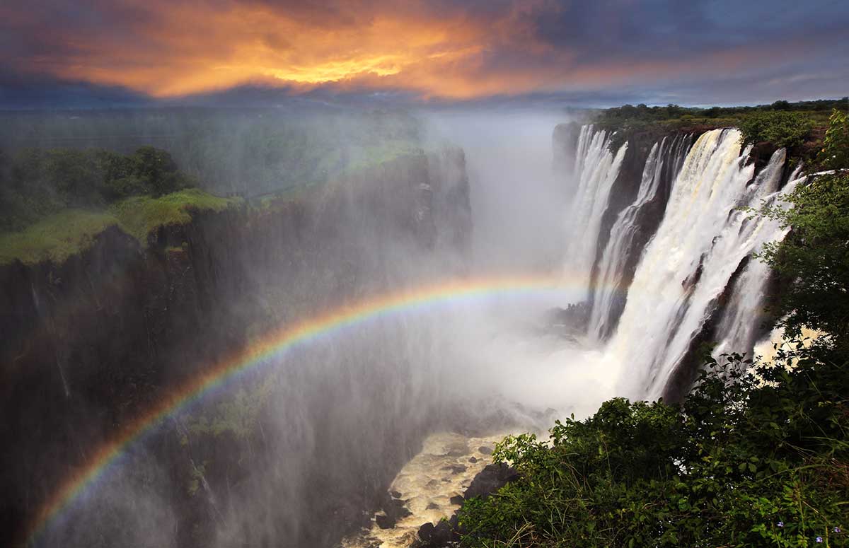 Victoria Falls with rainbow.