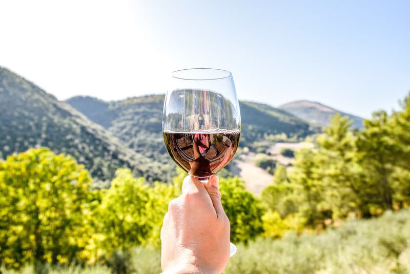 traveler enjoying wine and beautiful views in Perugia, a fun weekend trip from Rome