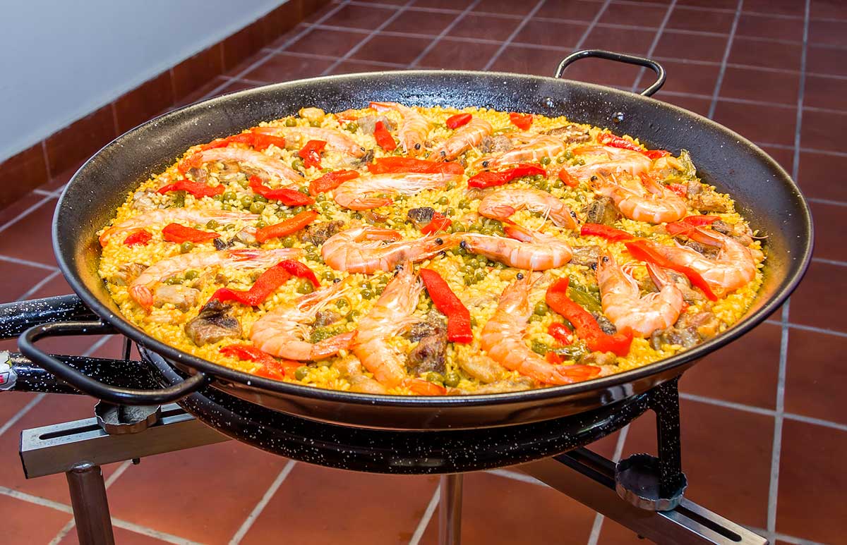 Traditional spanish paella cooked in a pan.