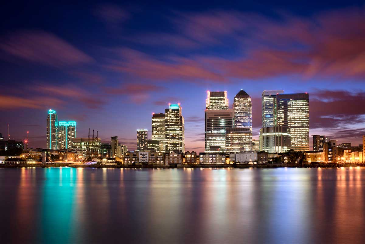 Colorful sunset over Canary Wharf, London, UK.