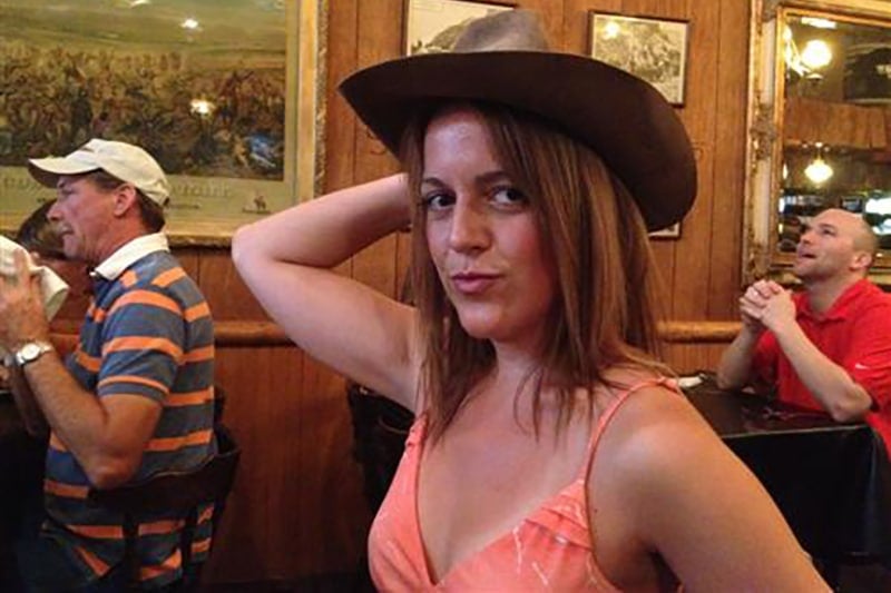 Trying on John Wayne's hat in Ouray, Colorado during an ultimate road trip USA