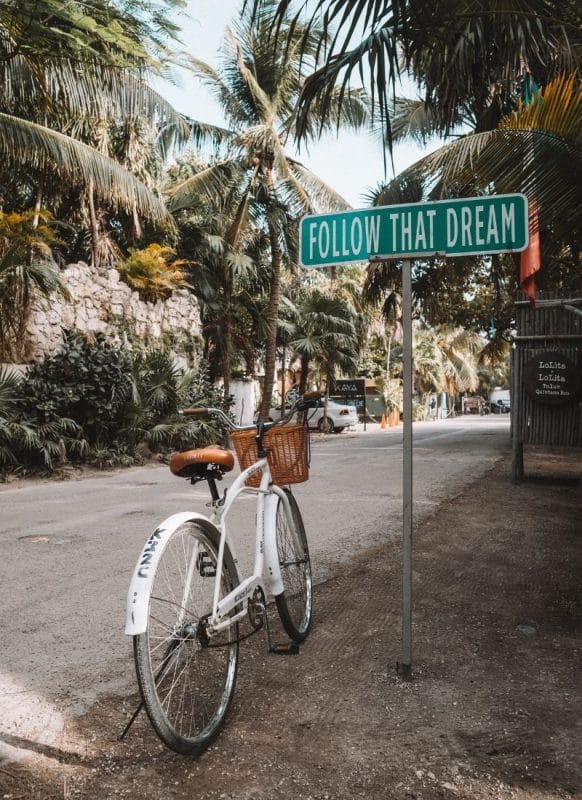 Seeing the Follow The Dream sign on a Tulum solo female travel trip