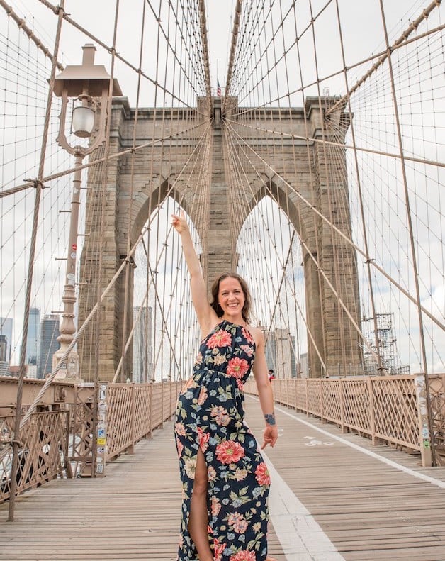 Woman walking the Brooklyn Bridge, one of the best things to do in NYC by yourself