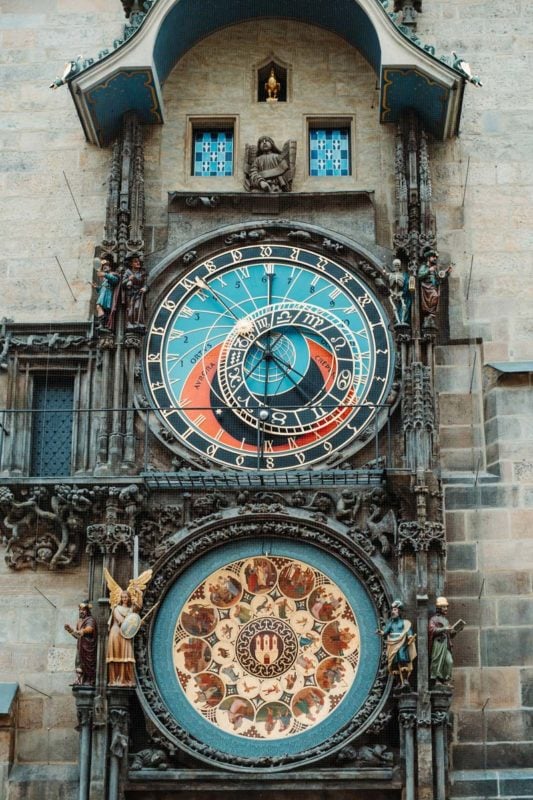 Visiting the Astronomical Clock in the Old Town Square during solo travel in Prague