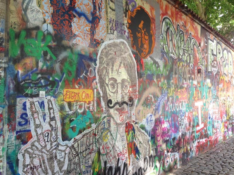 Visiting the Lennon Wall during solo travel in Prague