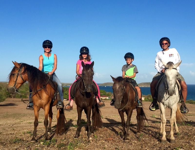 True short adventure stories on horseback riding on the black sand beach In Vieques