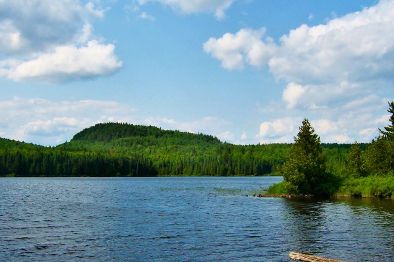 Eagle Mountain and the blue waters of Whale Lake as seen while hiking near Grand Marais MN