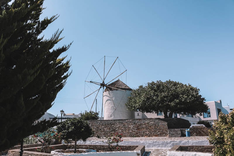 woman visiting the Paros Island windmill in Greece while traveling Europe solo