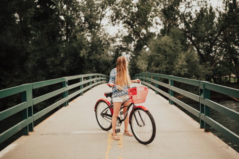 woman cycling the Greenbelt in Boise, Idaho during female solo travel in the USA