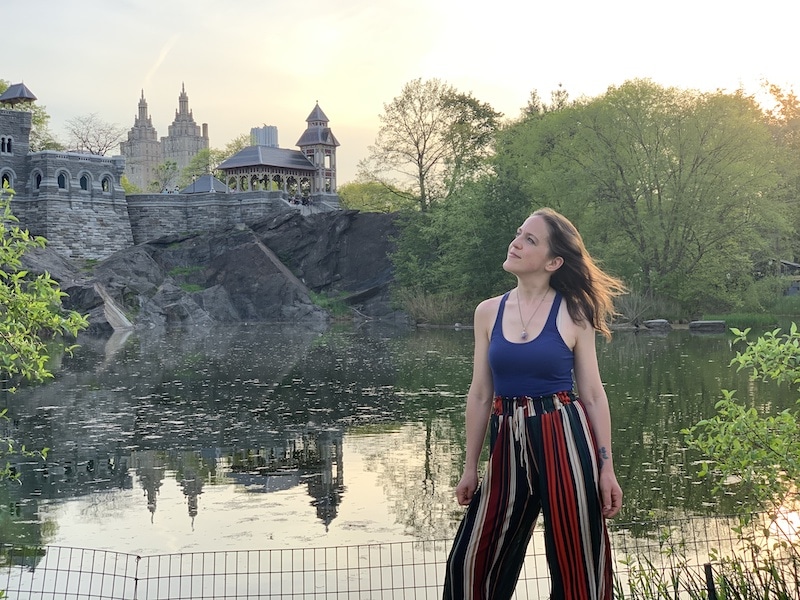 woman posing in front of Belvedere Castle in Central Park