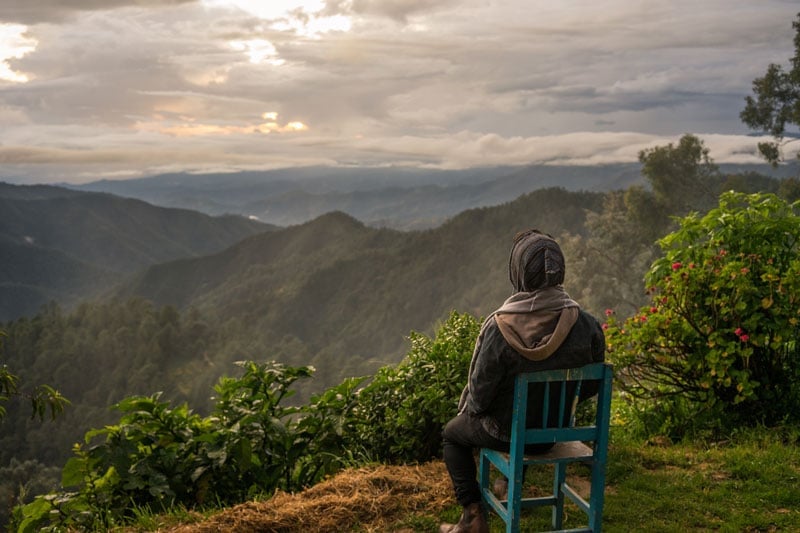 solo traveler in Mexico taking in the mountain views of San Jose del Pacifico