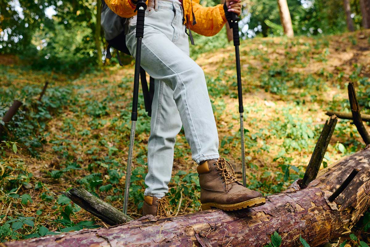 A photo of a woman wearing hiking boots.