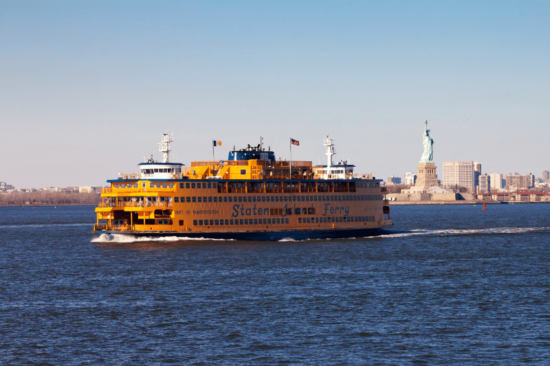 View of the Staten Island Ferry with the Statue of Liberty behind it