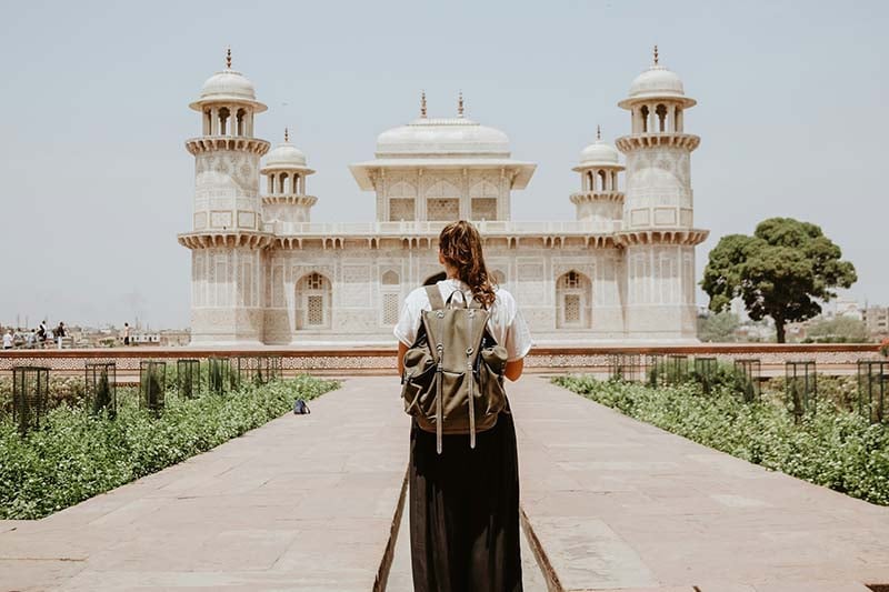 Woman walking to Tomb of I’timād-ud-Daulah, Agra, India.