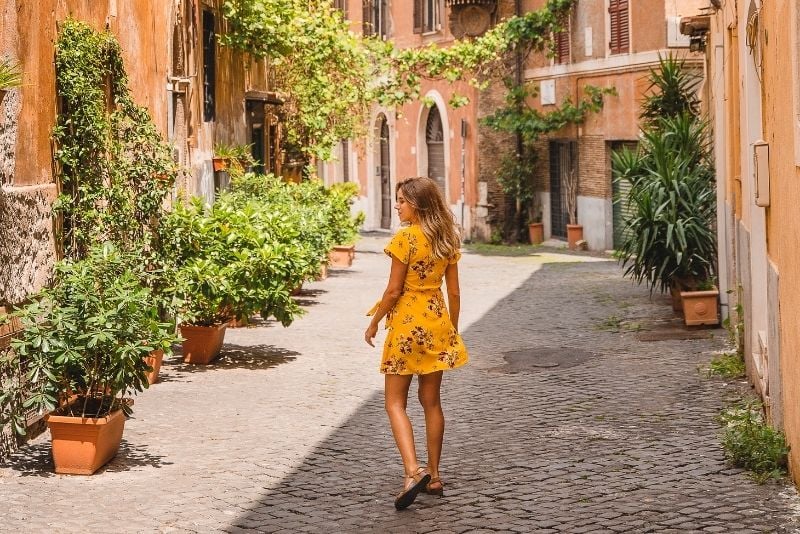 solo female traveler in Rome wandering the streets of the Trastevere neighborhood
