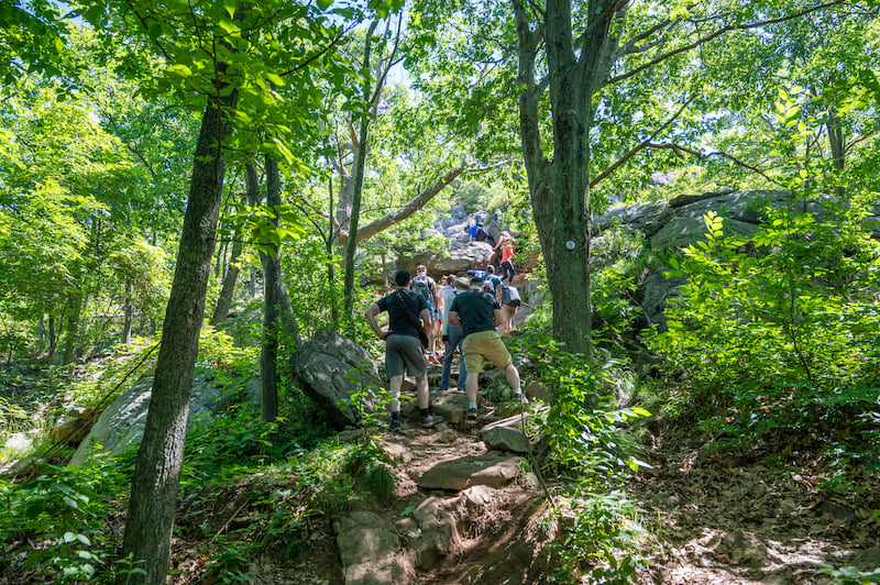 people hike Breakneck Ridge to get to the next viewpoint