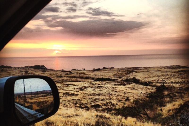seeing the sunset during a Big Island road trip in Hawaii