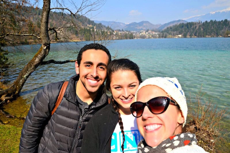 woman having fun traveling solo at Lake Bled in Slovenia