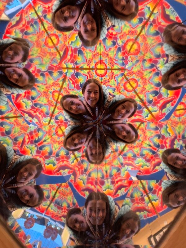woman looking through a kaleidoscope at Emerson Resort in the Catskills of Upstate New York