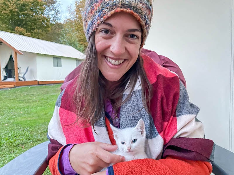 woman holding a white kitten at Gilbertsville Farmhouse