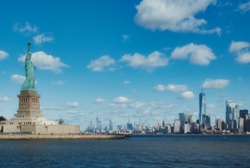 Statue of Liberty and Manhattan skyline side-by-side