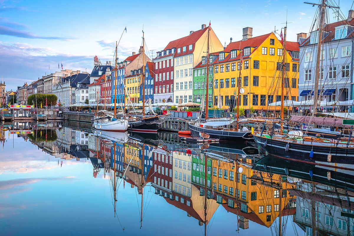 colorful houses and boats on the Nyhavn waterfront in Copenhagen