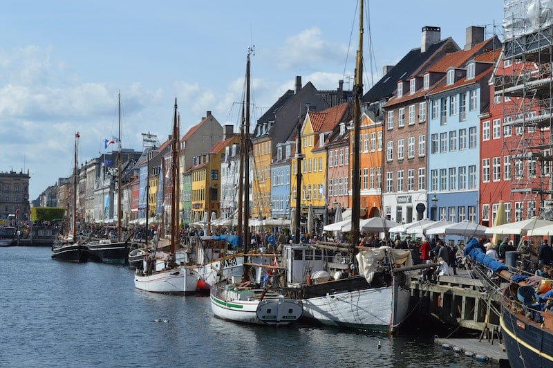 colorful houses and boats on the Nyhavn waterfront in Copenhagen