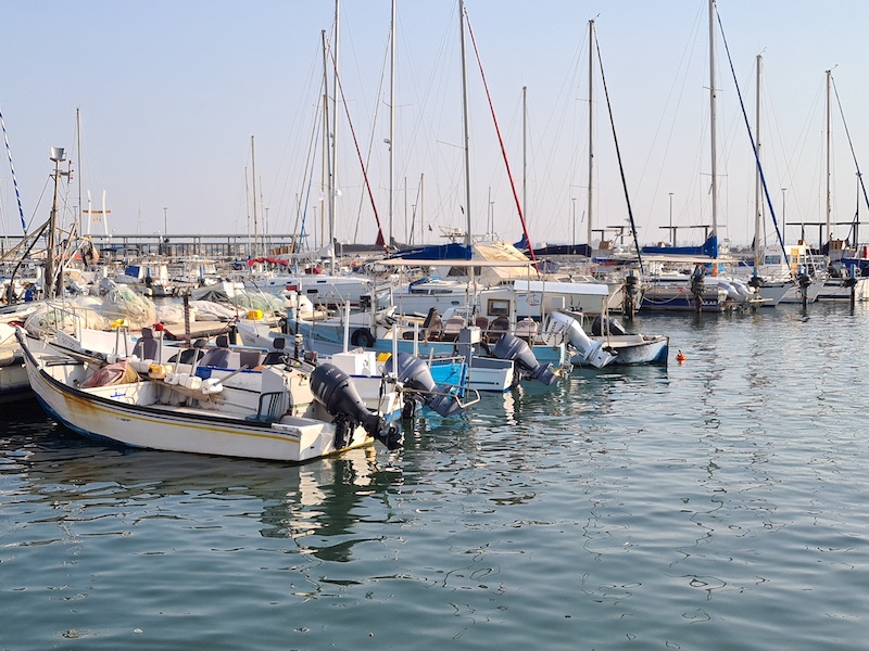 Port of Akko with boats in the water in Israel, Middle East