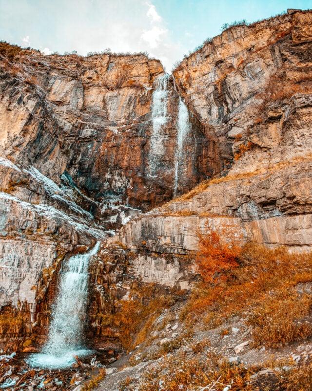 Stewart Falls waterfall gushing down rock canyon