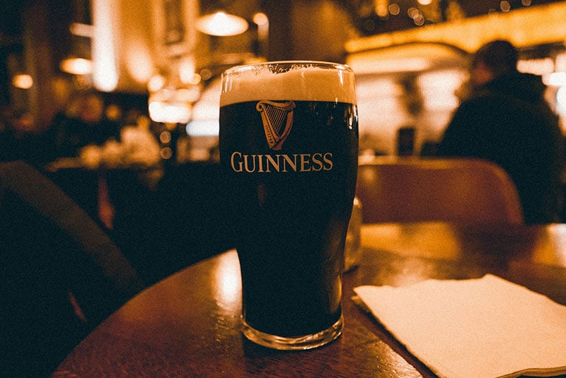 A close up photo of a glass of Guinness beer.
