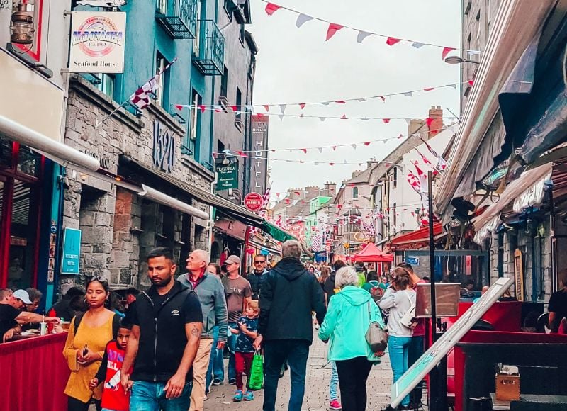 people wandering the Latin Quarter in Galway