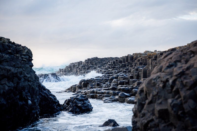 giant basalt rocks rising up from the ocean