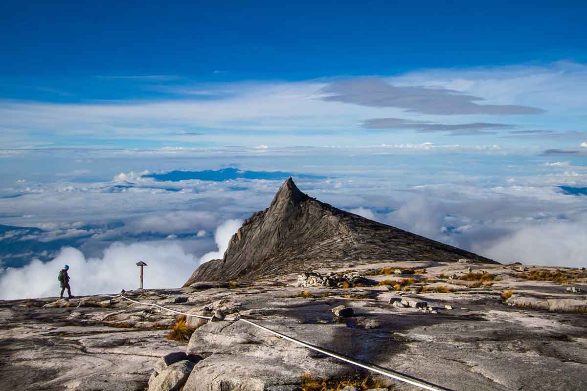 hiker walking up to the peak of Mount Kinabalu