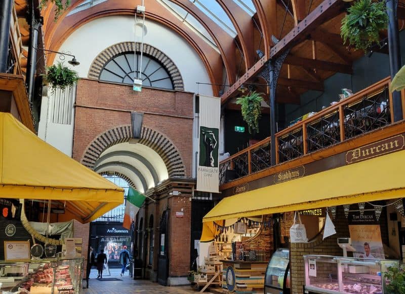 woman visiting a historic market in Cork during solo travel in Ireland