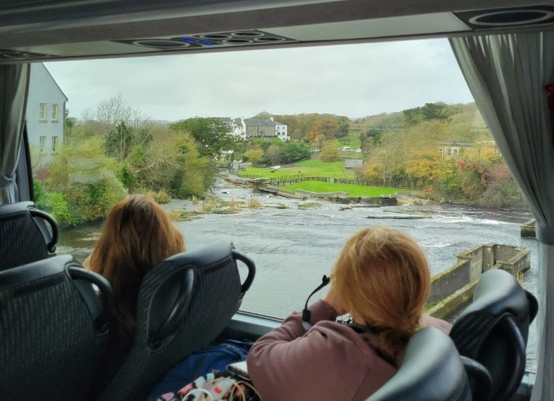 woman taking a group tour while traveling solo in Ireland