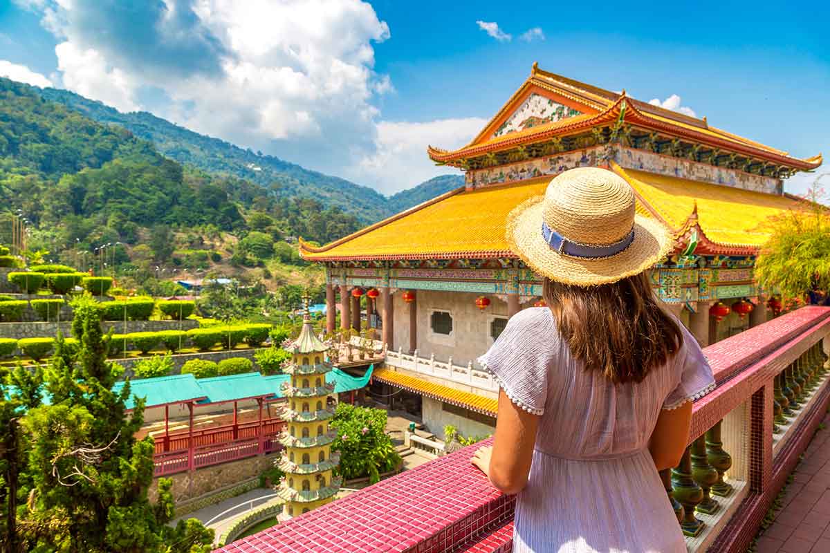 Woman traveler at Kek Lok Si Temple in Georgetown, Penang island, Malaysia.