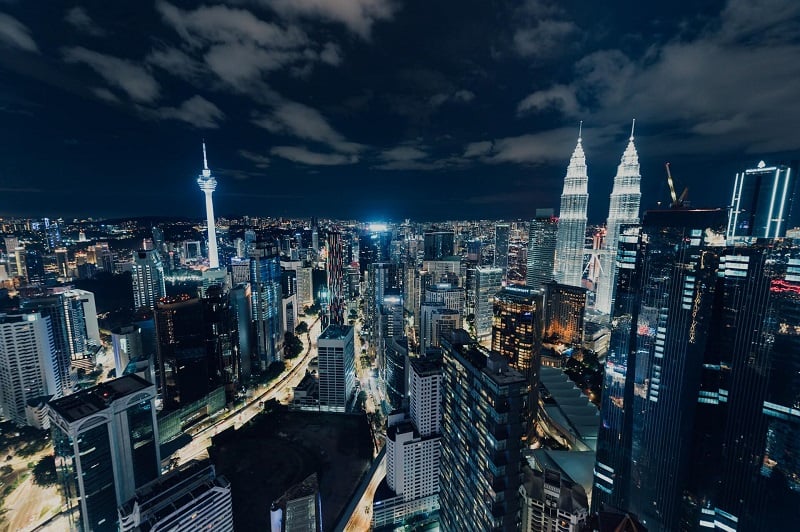 the Kuala Lumpur skyline lit up at night