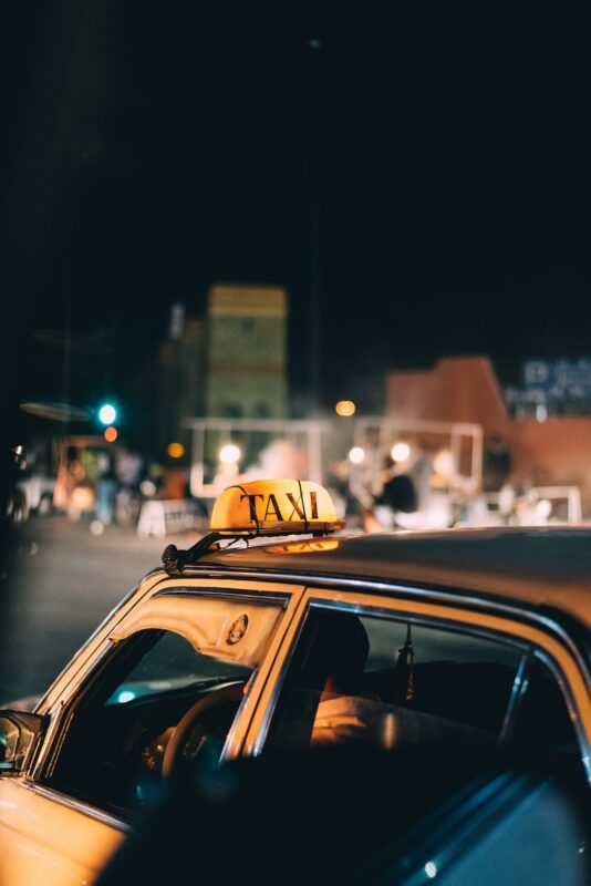 yellow taxi driving at night