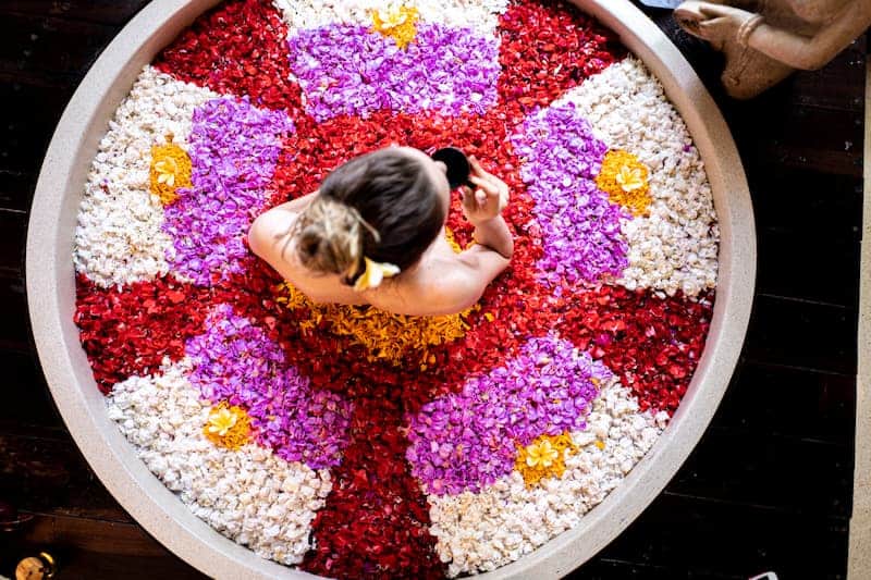 woman enjoying a Bali flower bath