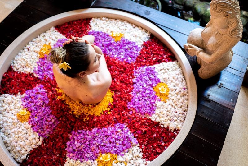 woman in a Bali flower bath