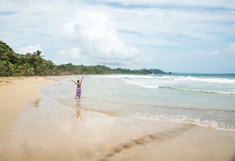 solo female traveler at Polo Beach in Bocas del Toro, Panama