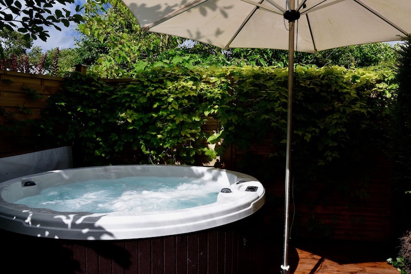 outdoor hot tub at Cotswold House Hotel & Spa