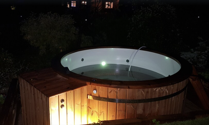 hot tub filled with water at night