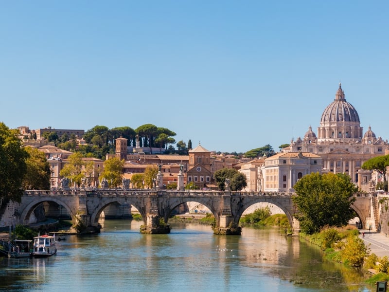 visiting the Tiber River in Rome on a solo trip to Italy