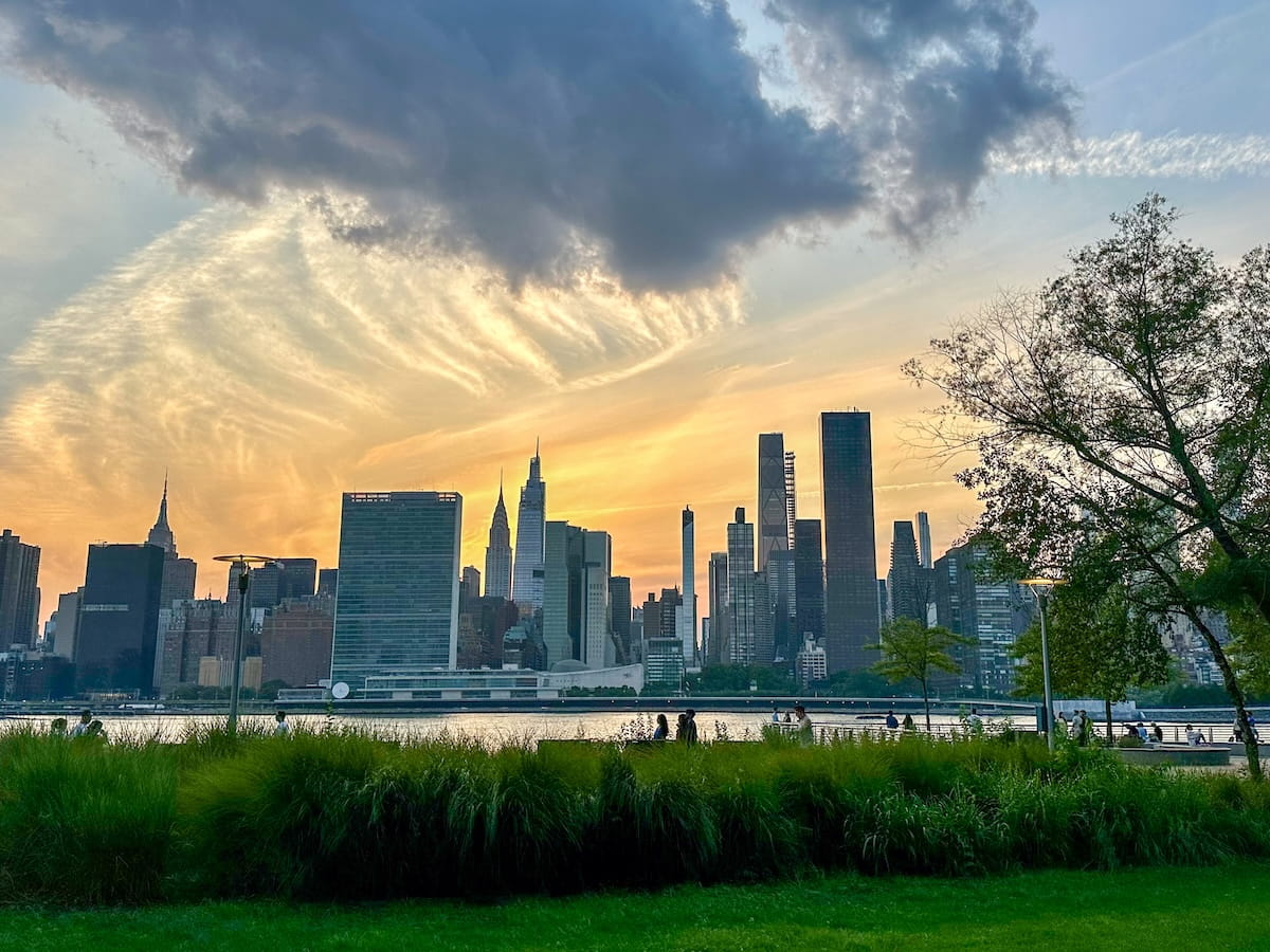 view of the Manhattan skyline from Gantry Plaza State Park in Queens at sunset