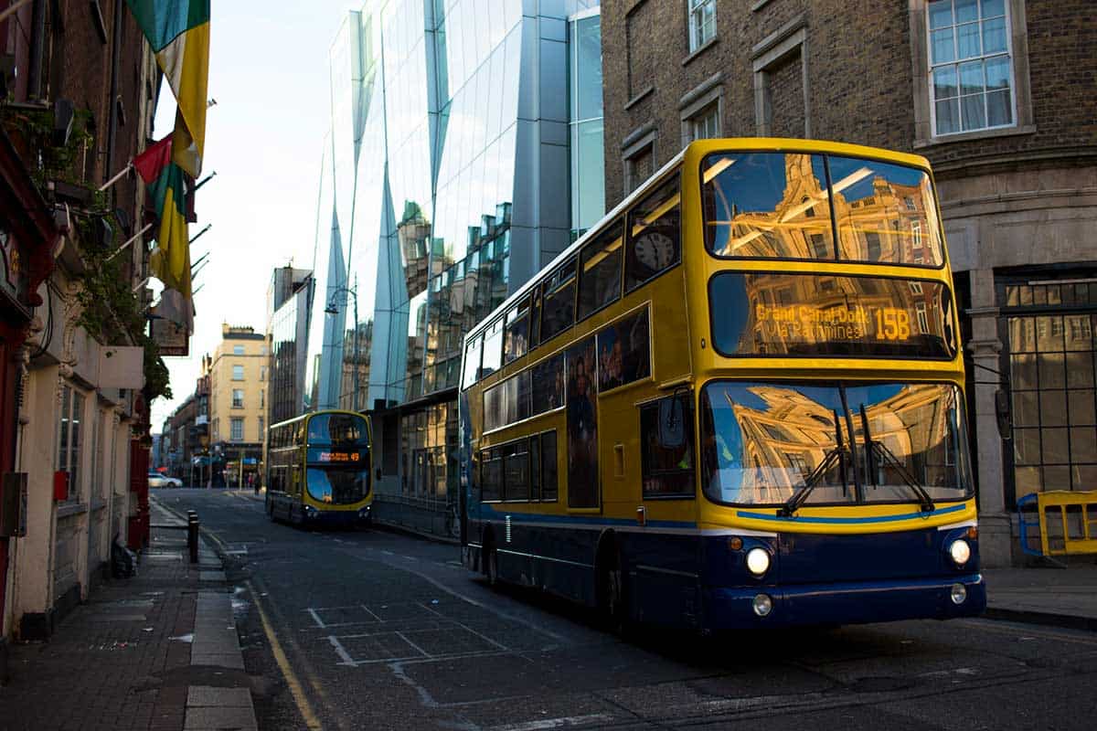 A bus driving through Dublin.