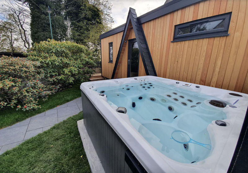 wood cabin with private hot tub in Scotland